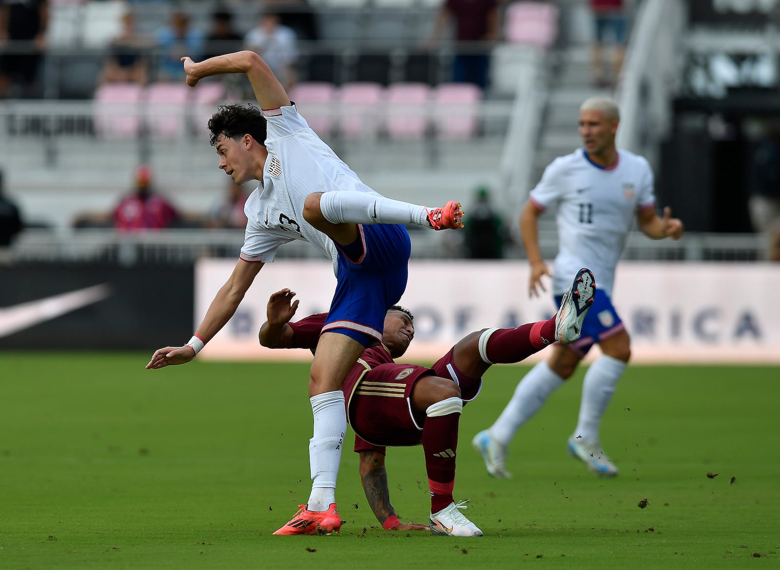 United States forward Caden Clark, top, collides with Venezuela defender Anthony Graterol during the first half of an international friendly soccer game, Saturday, Jan 18, 2025, in Fort Lauderdale, Fla. (AP Photo/Michael Laughlin)