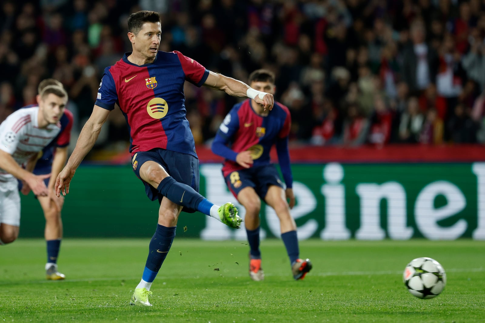 Barcelona's Robert Lewandowski shoots from the penalty spot to score his team's first goal during a Champions League phase soccer Matchday 5 between Barcelona and Brest at the Lluis Companys Olympic Stadium in Barcelona, Spain, Tuesday, Nov. 26, 2024. (AP Photo/Joan Monfort)