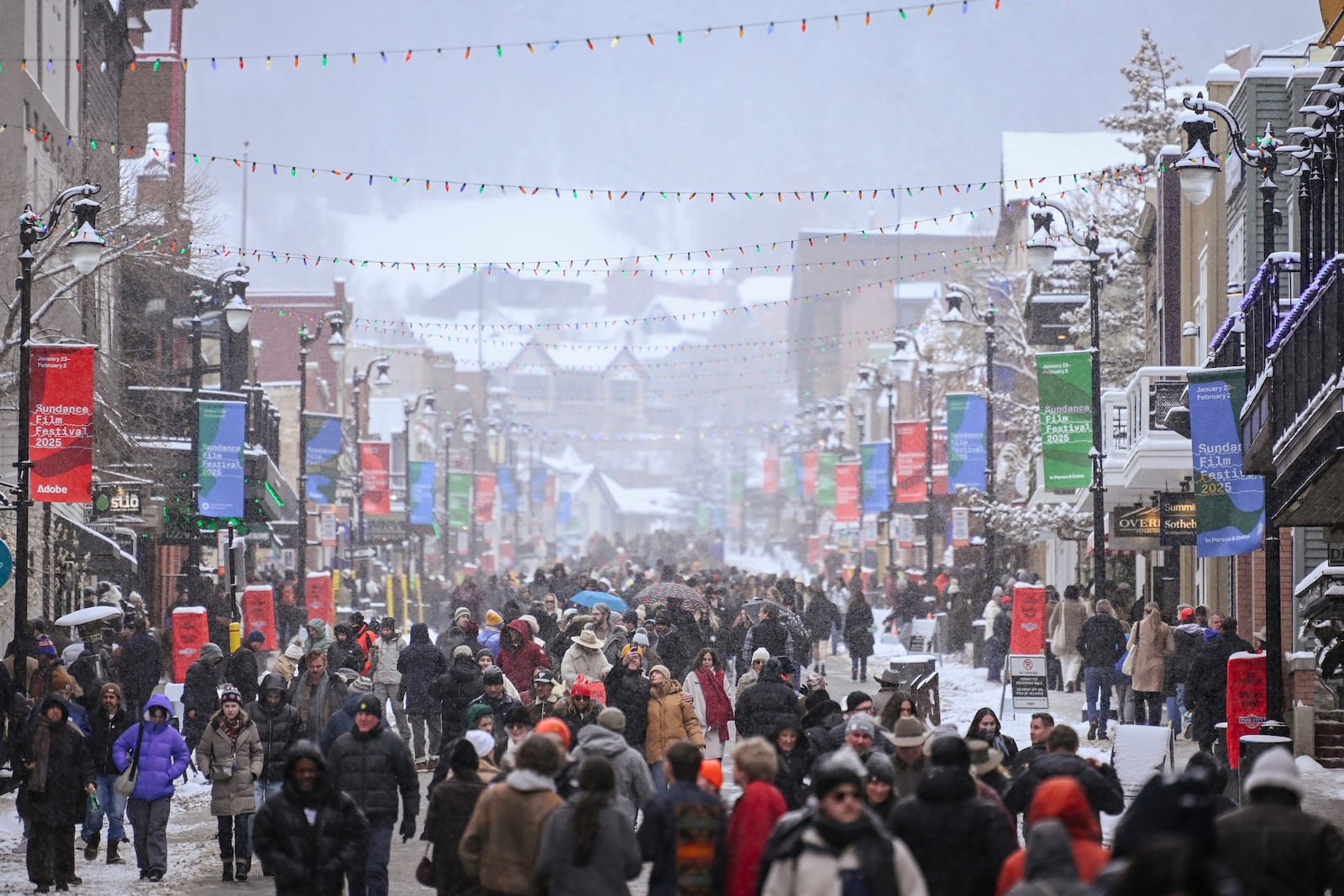 
                        A crowd walks down Main Street during Sundance in Park City, Utah, Jan. 25, 2025. The nonprofit behind Sundance, the pre-eminent festival for independent film held for the past 40 years in Park City, Utah, announced that it was exploring where else to hold the event in 2027 and beyond. (Alex Goodlett/The New York Times)
                      