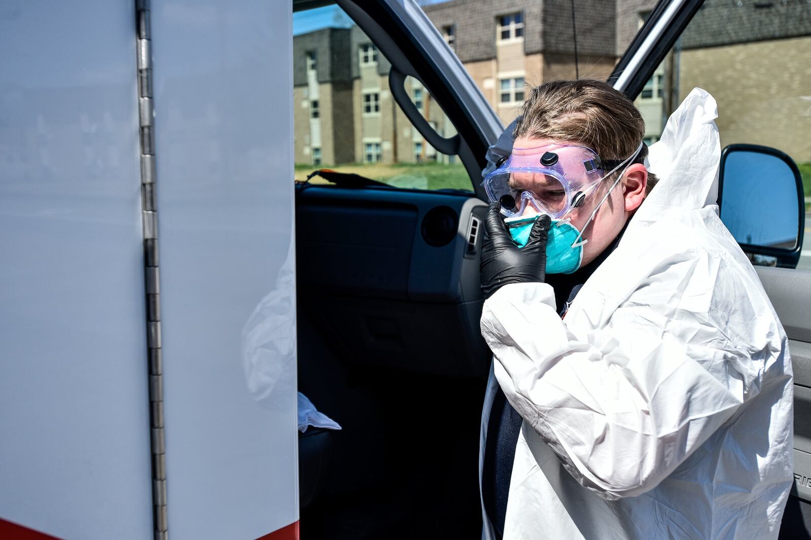 Hamilton firefighter paramedic Jason Bunger puts on his protective gear to demonstrate the decontamination process they are doing to medic units in response to the coronavirus (COVID-19) pandemic. They are using a fogger to coat the inside of the unit with disinfectant and wiping down the inside after ten minutes. NICK GRAHAM / STAFF