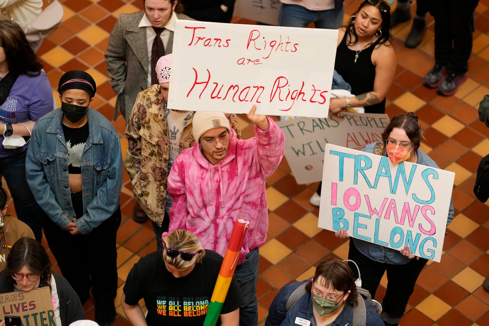 Protesters fill the Iowa state Capitol to denounce a bill that would strip the state civil rights code of protections based on gender identity, Thursday, Feb. 27, 2025, in Des Moines, Iowa. (AP Photo/Charlie Neibergall)