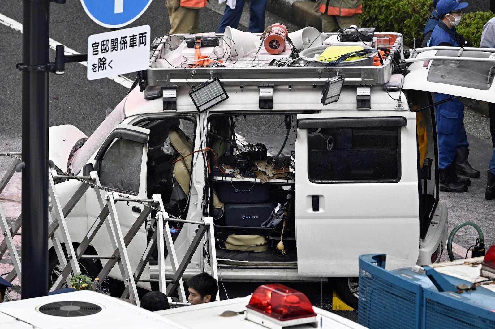 A vehicle is stuck against a barricade near the prime minister's office in Tokyo Saturday, Oct. 19, 2024. (Kyodo News via AP)