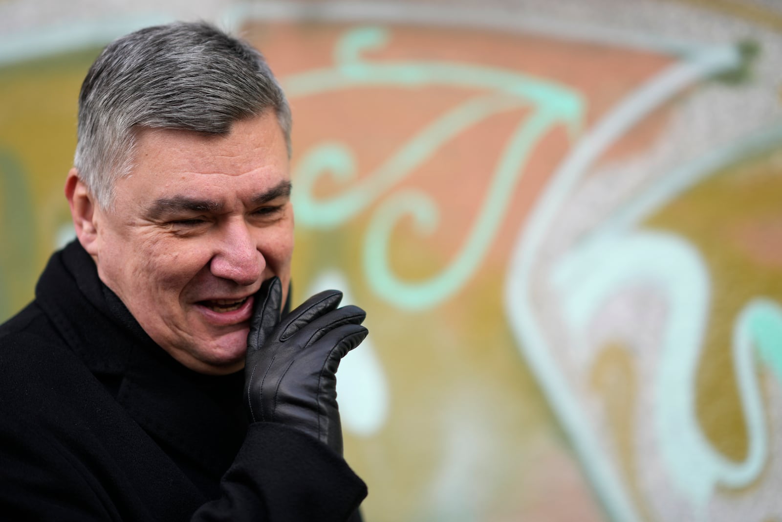 President incumbent Zoran Milanovic talks to media after casting his ballot during a runoff vote for the Croatian presidential election at a polling station in Zagreb, Croatia, Sunday, Jan. 12, 2025. (AP Photo/Darko Bandic)