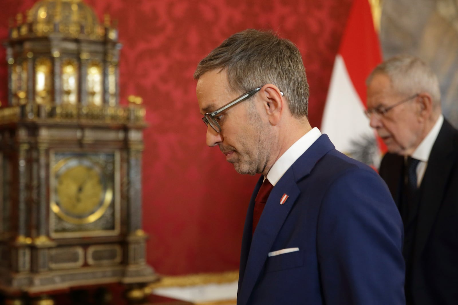 Austrian Freedom Party leader Herbert Kickl, center, arrives next to Austrian President Alexander Van der Bellen at the presidential office, in Vienna, Austria, Monday, Jan. 06, 2025. (AP Photo/Heinz-Peter Bader)