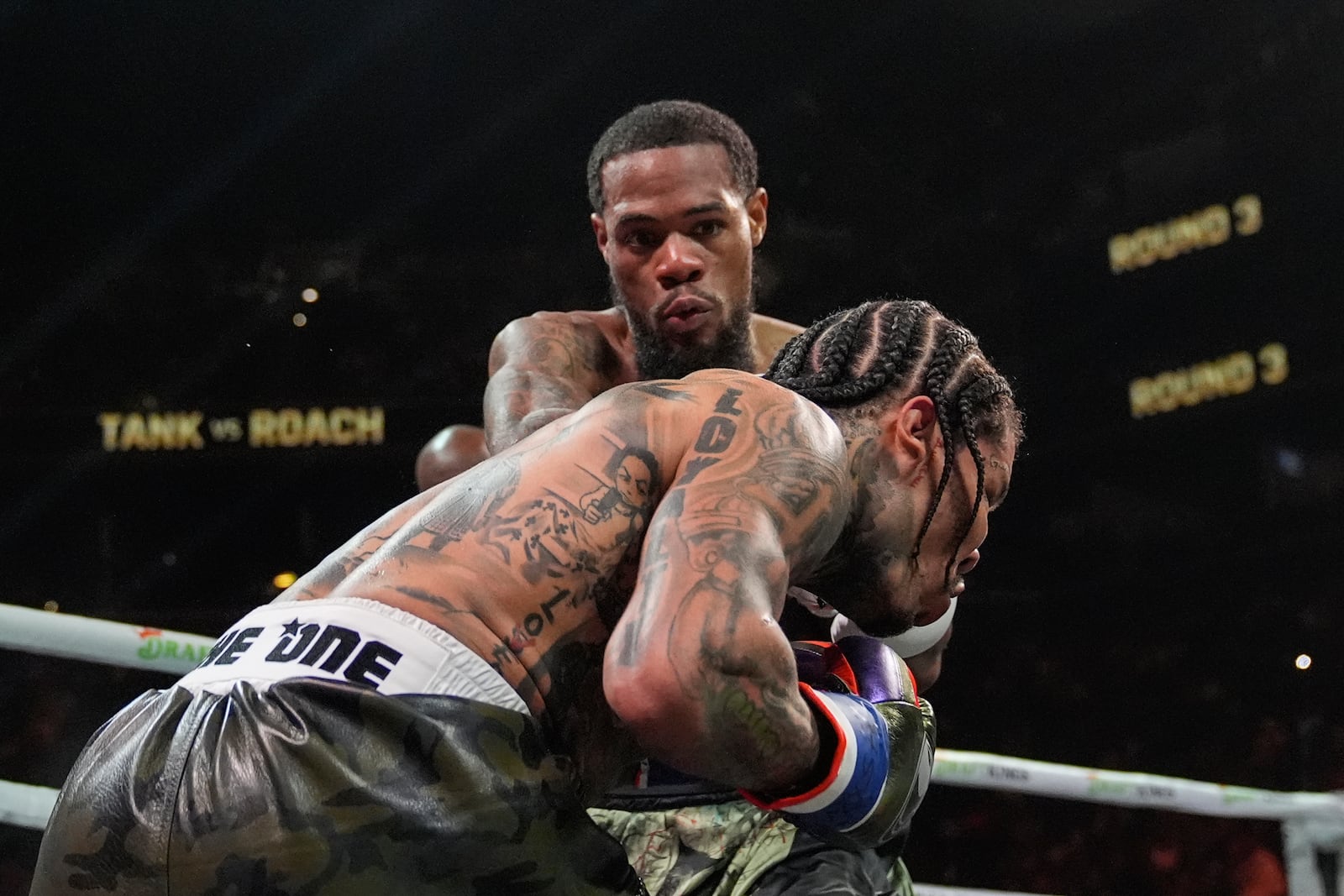 Lamont Roach, left, punches Gervonta Davis during the third round of a WBA lightweight championship boxing bout Saturday, March 1, 2025, in New York. (AP Photo/Frank Franklin II)