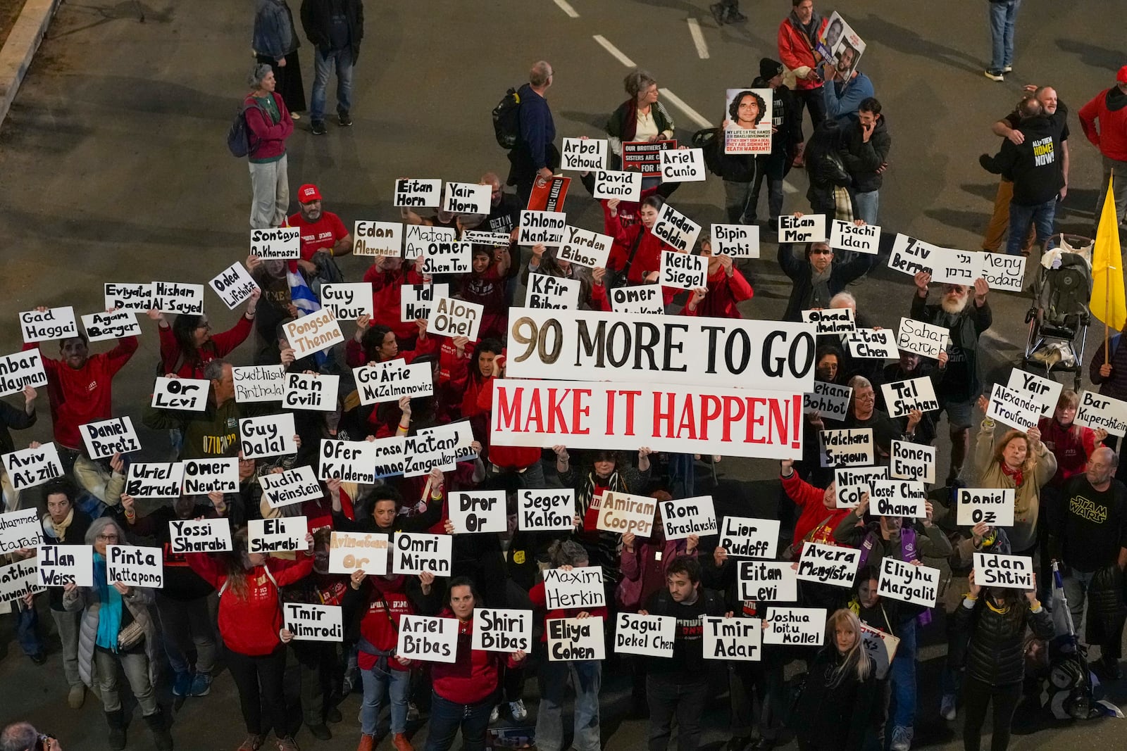 Demonstrators protest calling for the immediate release of the hostages held in the Gaza Strip by the Hamas militant group in Tel Aviv, Israel, Saturday, Jan. 25, 2025. (AP Photo/Ohad Zwigenberg)