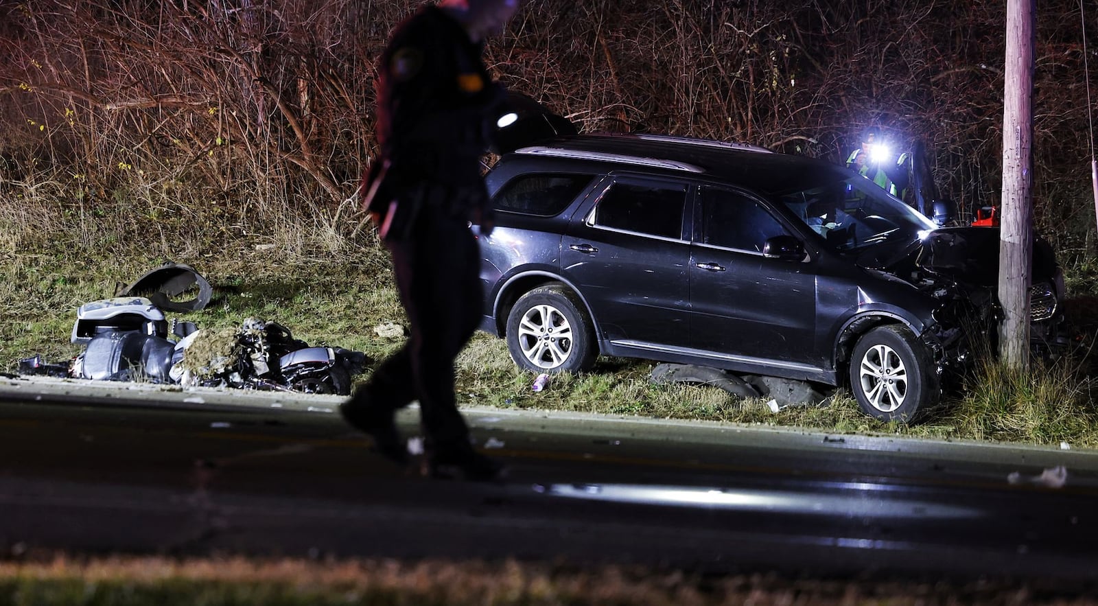 A motorcycle and SUV were involved in a crash Friday evening, Dec. 8, 2023, on state Route 122 at West Alexandria Road in Madison Twp. in Butler County. NICK GRAHAM/STAFF