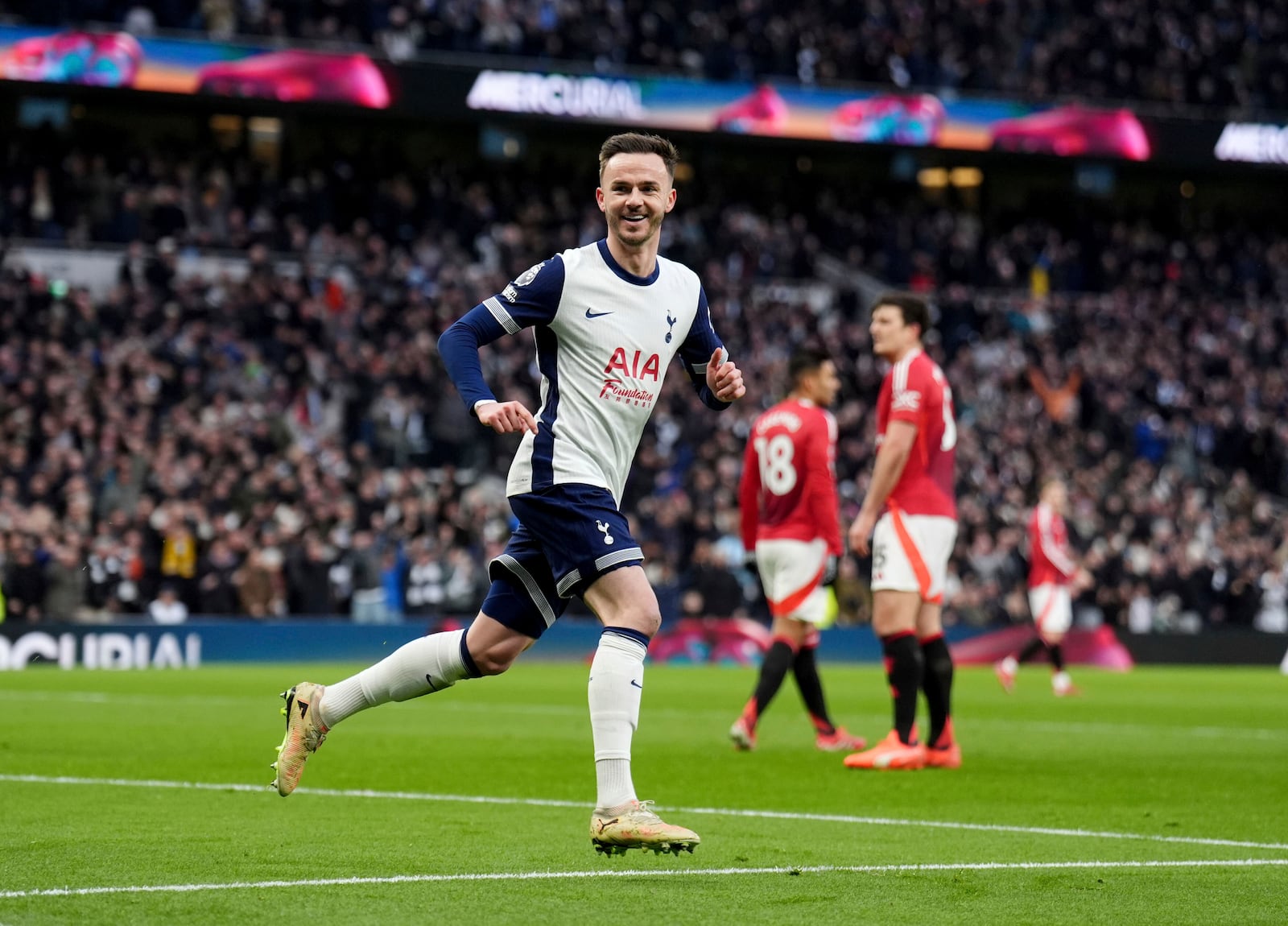 Tottenham's James Maddison celebrates after scoring the opening goal during the English Premier League soccer match between Tottenham Hotspur and Manchester United in London, Sunday, Feb. 16, 2025. (John Walton/PA via AP)