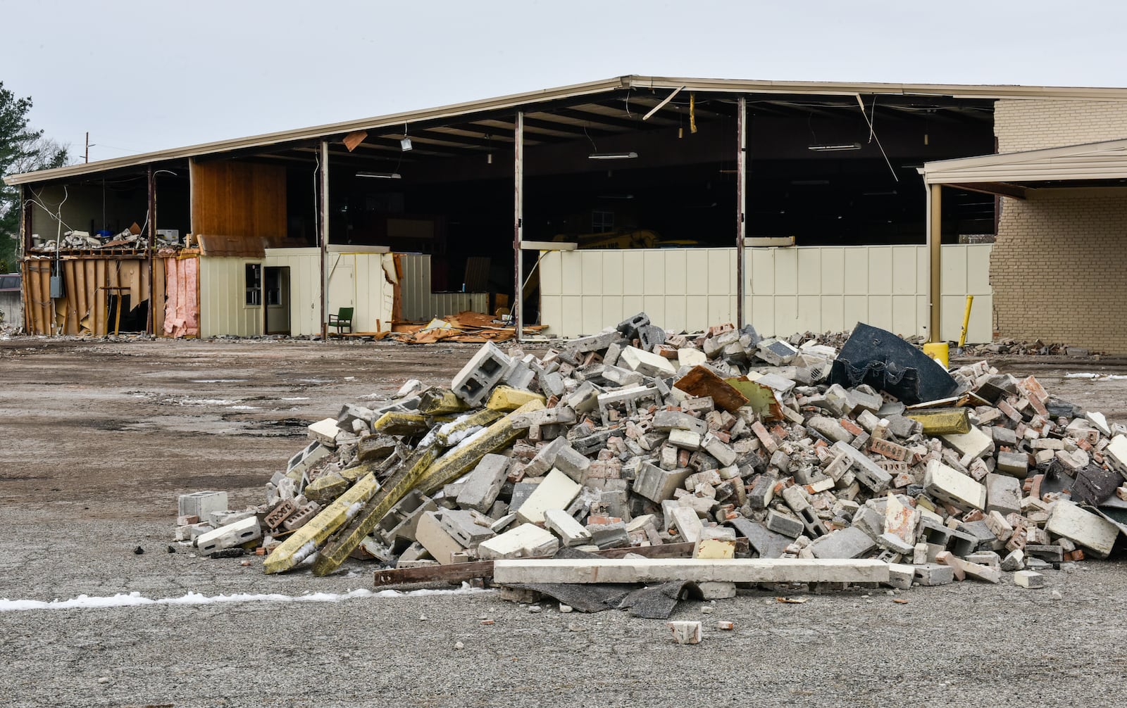 Demolition crews work to take down the Skating On Main roller skating rink Friday, Feb. 9, 2018 in Hamilton. NICK GRAHAM/STAFF