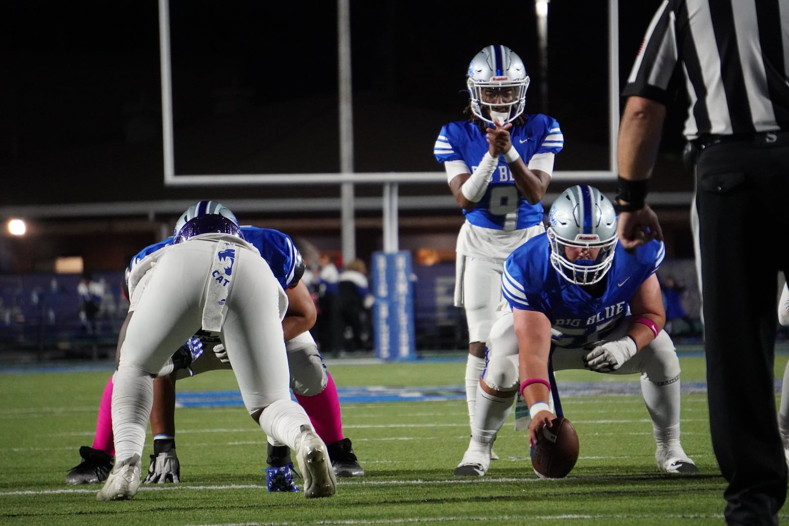 Hamilton quarterback Antonio Mathis takes a snap against Middletown in the Butler Bowl on Friday night at Virgil Schwarm Stadium. Chris Vogt/CONTRIBUTED