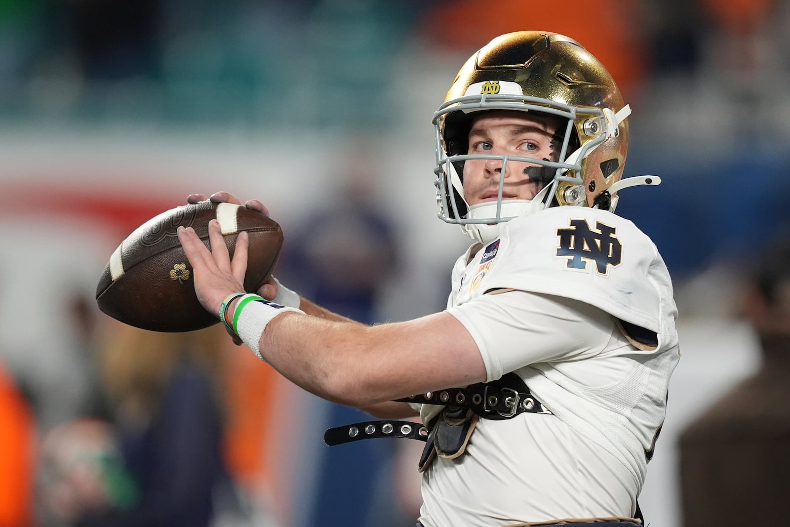 Notre Dame quarterback Riley Leonard (13) warms up before the Orange Bowl NCAA College Football Playoff semifinal game against Penn State, Thursday, Jan. 9, 2025, in Miami Gardens, Fla. (AP Photo/Rebecca Blackwell)