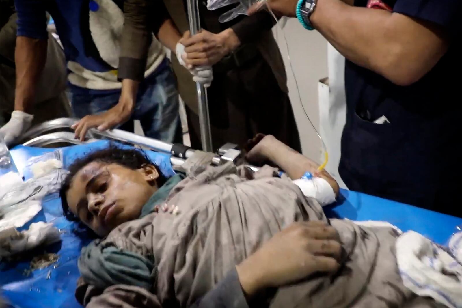 In this photo taken from video released by Ansar Allah Media Office via Al Masirah TV channel shows a wounded child being taken for treatment at a hospital in Saada, Yemen, Saturday, March 15, 2025 following airstrikes over multiple targets in the country. The Houthi-run Health Ministry said the overnight strikes killed at least 31 people, including women and children, and wounded over 100 in the capital of Sanaa and the northern province of Saada, the rebels' stronghold on the border with Saudi Arabia.( Al Masirah TV via AP)