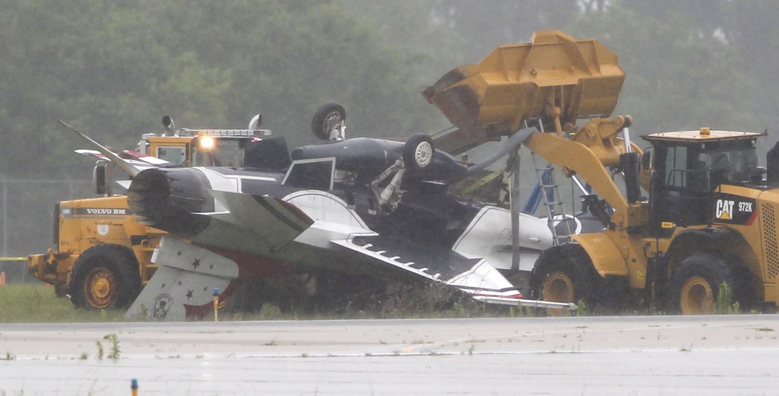 A Thunderbird jet flipped over after taxiing at Dayton International Airport on Friday, June 23, 2017. TY GREENLEES / STAFF