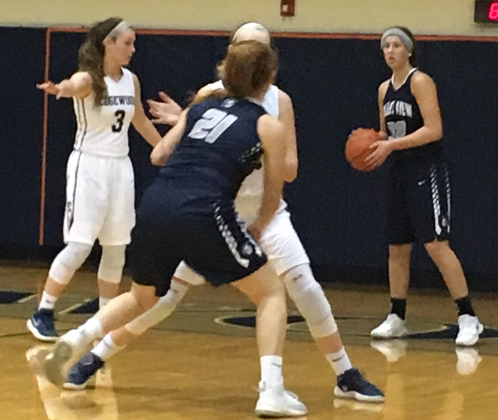 Valley View’s Hunter Stidham prepares to inbound the ball as teammate Ryan Hawkey (21) tries to get open Monday night at Ron Kash Court in St. Clair Township. Edgewood’s Tori Childers (3) is among the Cougars playing defense. RICK CASSANO/STAFF