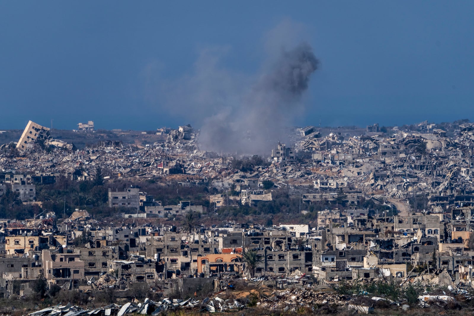 Smoke rises following an explosion in the Gaza Strip, as seen from southern Israel, Tuesday, Jan. 7, 2025. (AP Photo/Ariel Schalit)