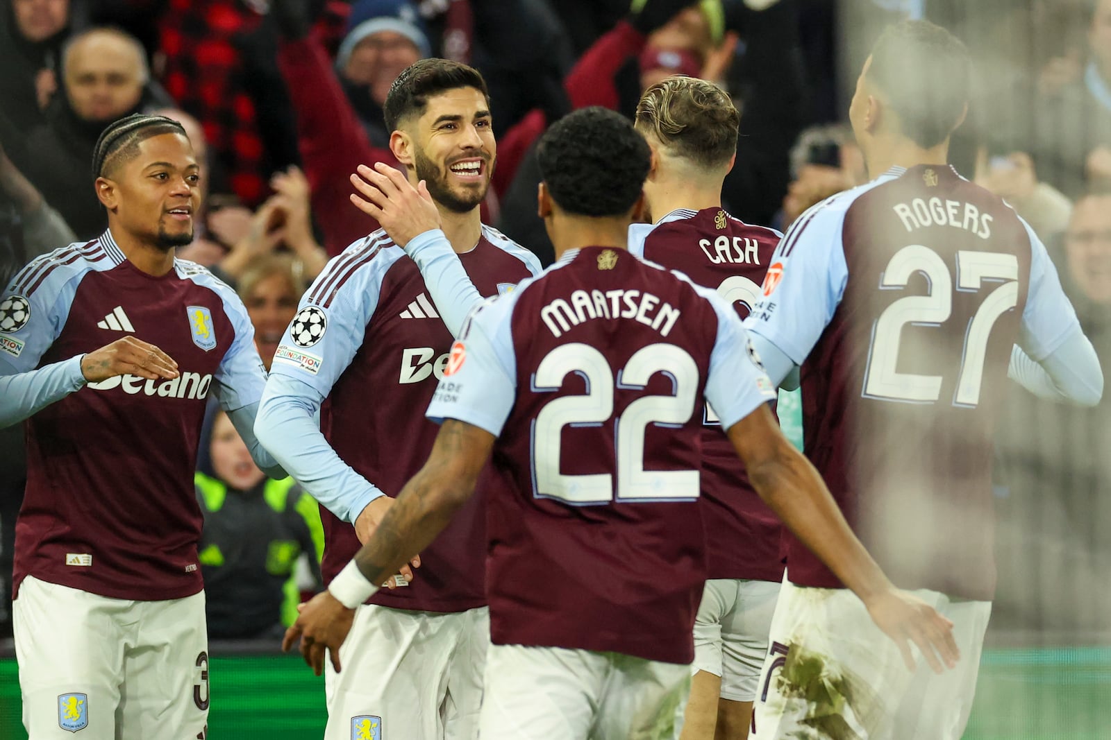 Aston Villa's Marco Asensio, second left, celebrates with teammates after scoring opening goal during the Champions League round of 16 second leg soccer match between Aston Villa and Club Brugge at the Villa Park stadium in Birmingham, England, Wednesday, March 12, 2025. (AP Photo/Darren Staples)