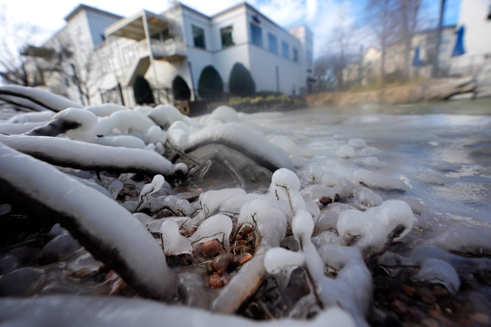 Water freezes in low temperatures in Allen, Texas, Thursday, Feb. 20, 2025. (AP Photo/LM Otero)