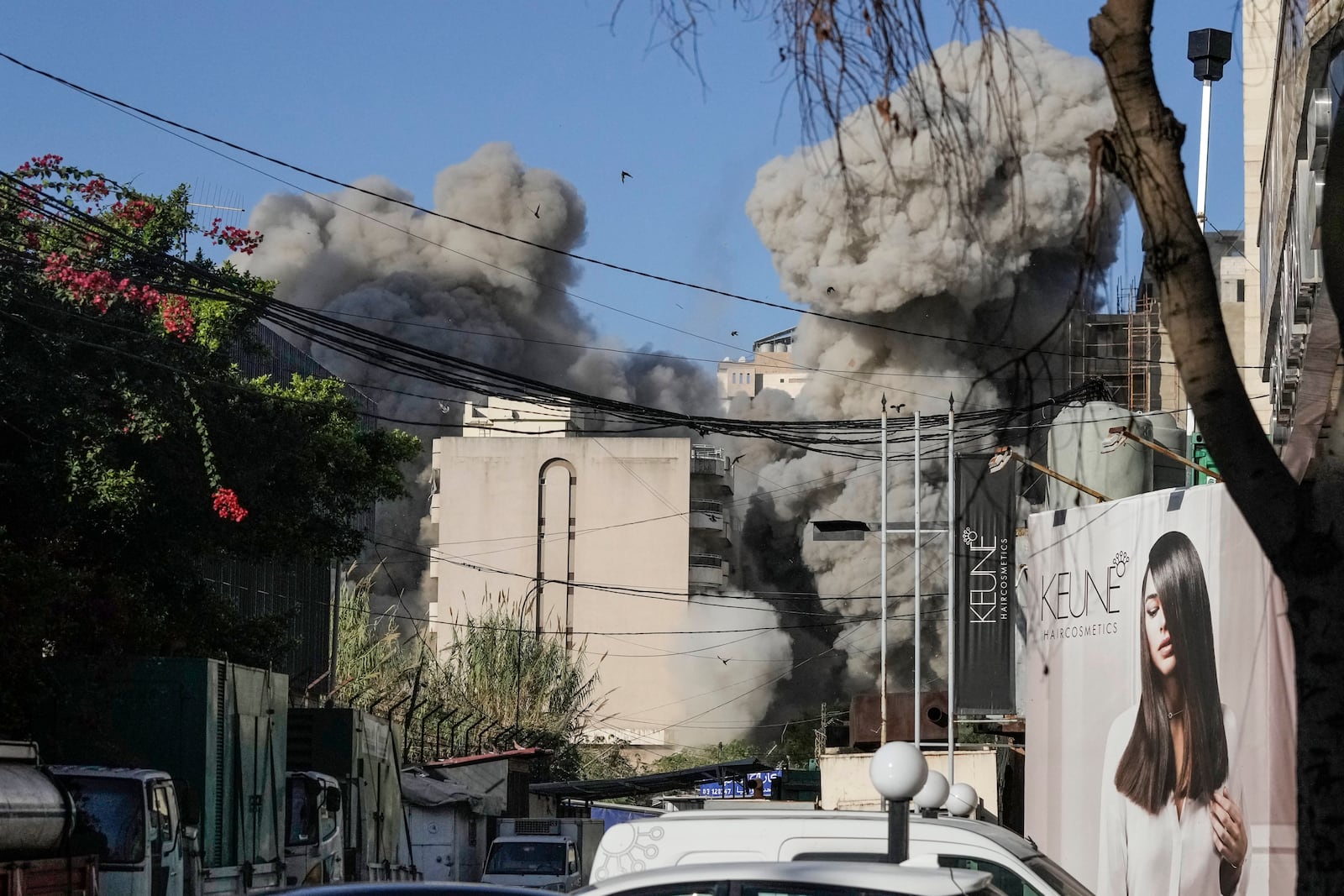 Smoke rises from a building collapsing after it was hit by an Israeli airstrike in Chiyah, south of Beirut, Lebanon, Sunday, Nov. 17, 2024. (AP Photo/Bilal Hussein)