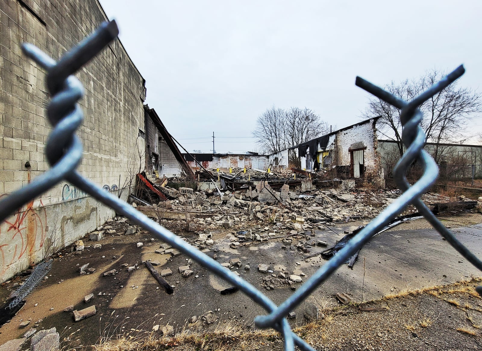 Debris remains Wednesday, Dec.. 30, 2020 nearly a year after the former Middletown Paperboard complex was destroyed by fire. Firefighters from multiple departments battled the fire that started on January 1, 2020. NICK GRAHAM  / STAFF