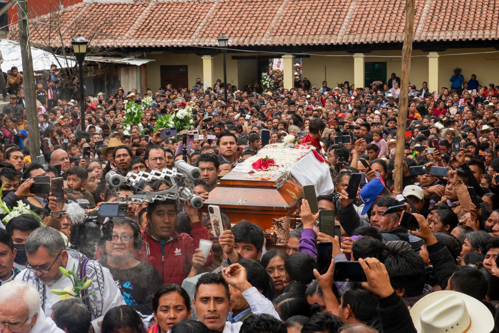 Residents accompany the coffin that contain the remains of slain Catholic priest and activist Marcelo Pérez, in San Andrés Larráinzar, Chiapas state, Mexico, Tuesday, Oct. 22, 2024. (AP Photo/Isabel Mateos)