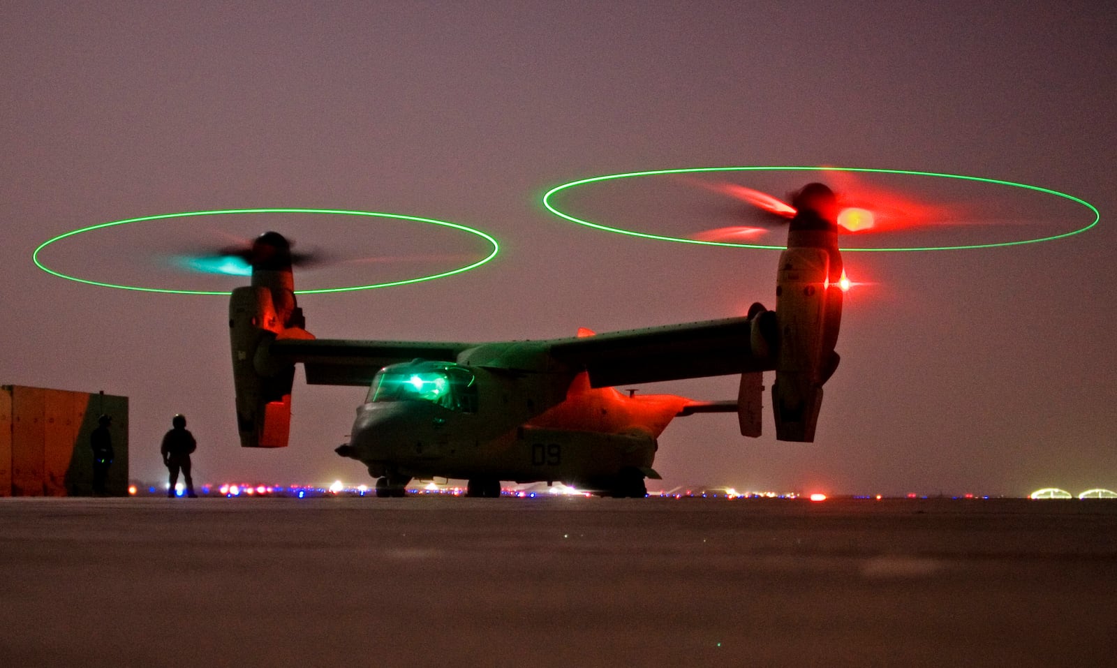 FILE - A V-22 Osprey tilt rotor aircraft taxi's during a mission in western Iraqi desert, Oct. 13, 2008. (AP Photo/Dusan Vranic, File)