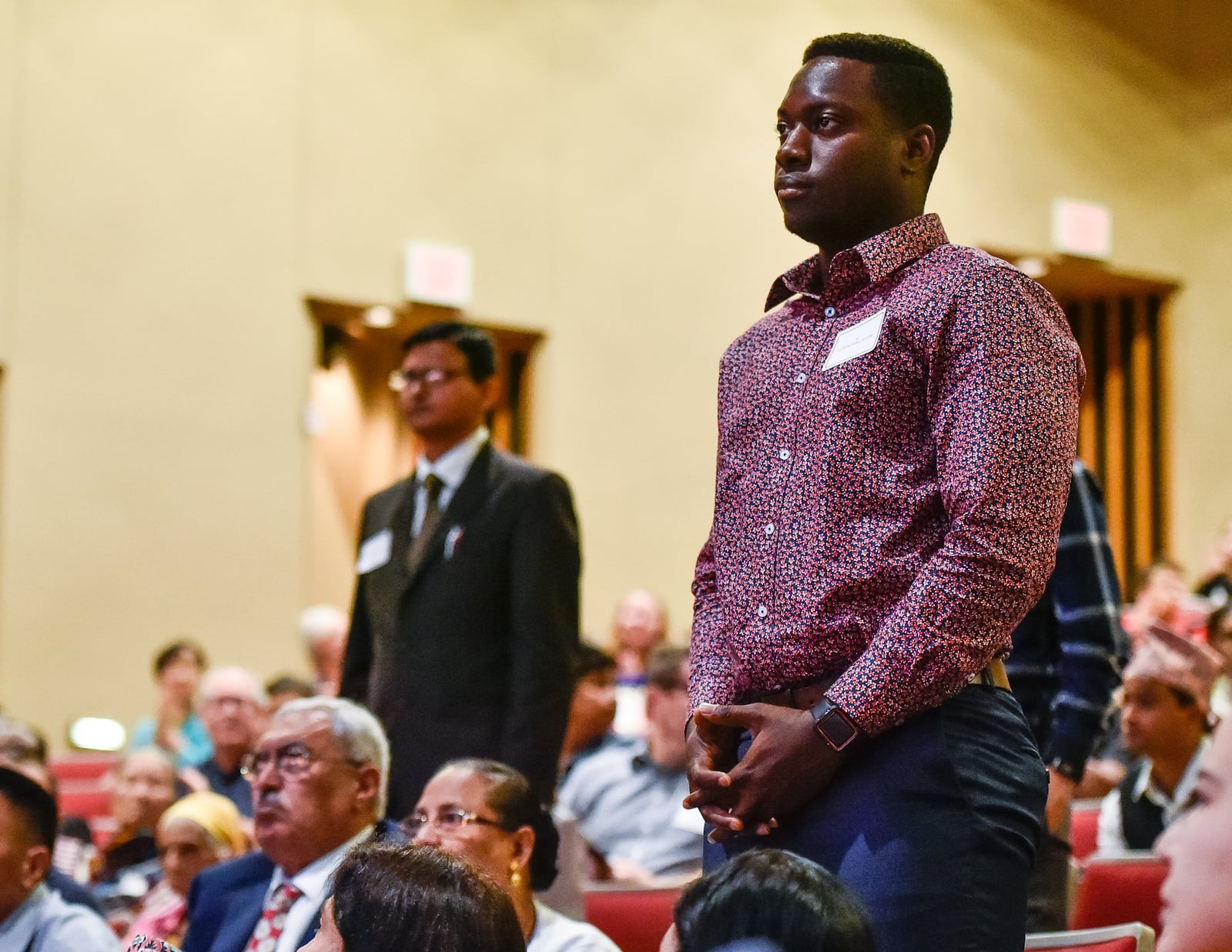 Jeffery Asubeng, from Ghana, right, who serves in U.S. Army Reserves was one of the 99 people who became U.S. citizens during a naturalization ceremony Monday, Sept. 17 at Miami University Hamilton’s Parrish Auditorium in Hamilton. Standing at left is Prasanna Guru, from India, who also serves in the U.S. Army Reserves and became a citizen. 