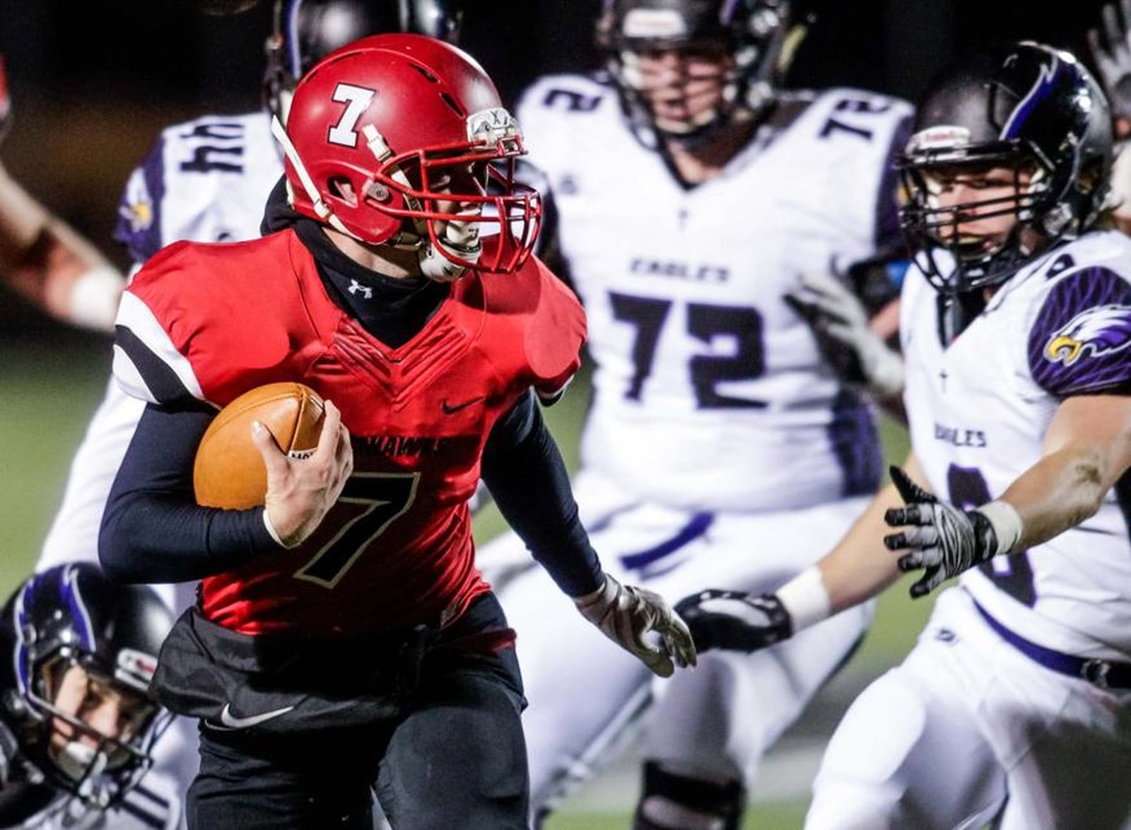 Madison quarterback Mason Whiteman (7) takes off with the ball during Friday night’s Division V, Region 20 semifinal against Cincinnati Hills Christian Academy at Lakota East. NICK GRAHAM/STAFF