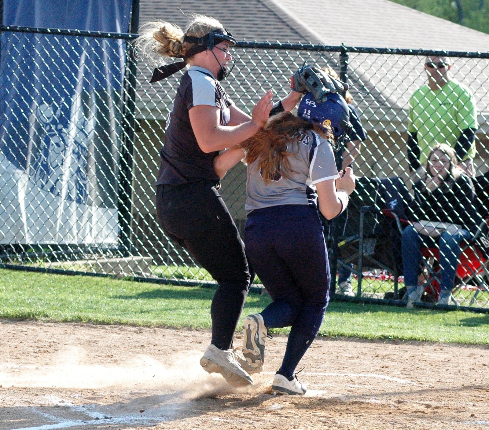 Middletown pitcher Carly Metcalf can’t stop Fairmont’s Hilarie Spitler from scoring on a wild pitch Tuesday during a Division I district softball semifinal at Miamisburg. Farmont won 7-2. RICK CASSANO/STAFF