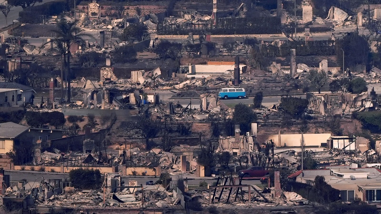 A VW van sits among burned out homes, Thursday, Jan. 9, 2025, in Malibu, Calif. (AP Photo/Mark J. Terrill)