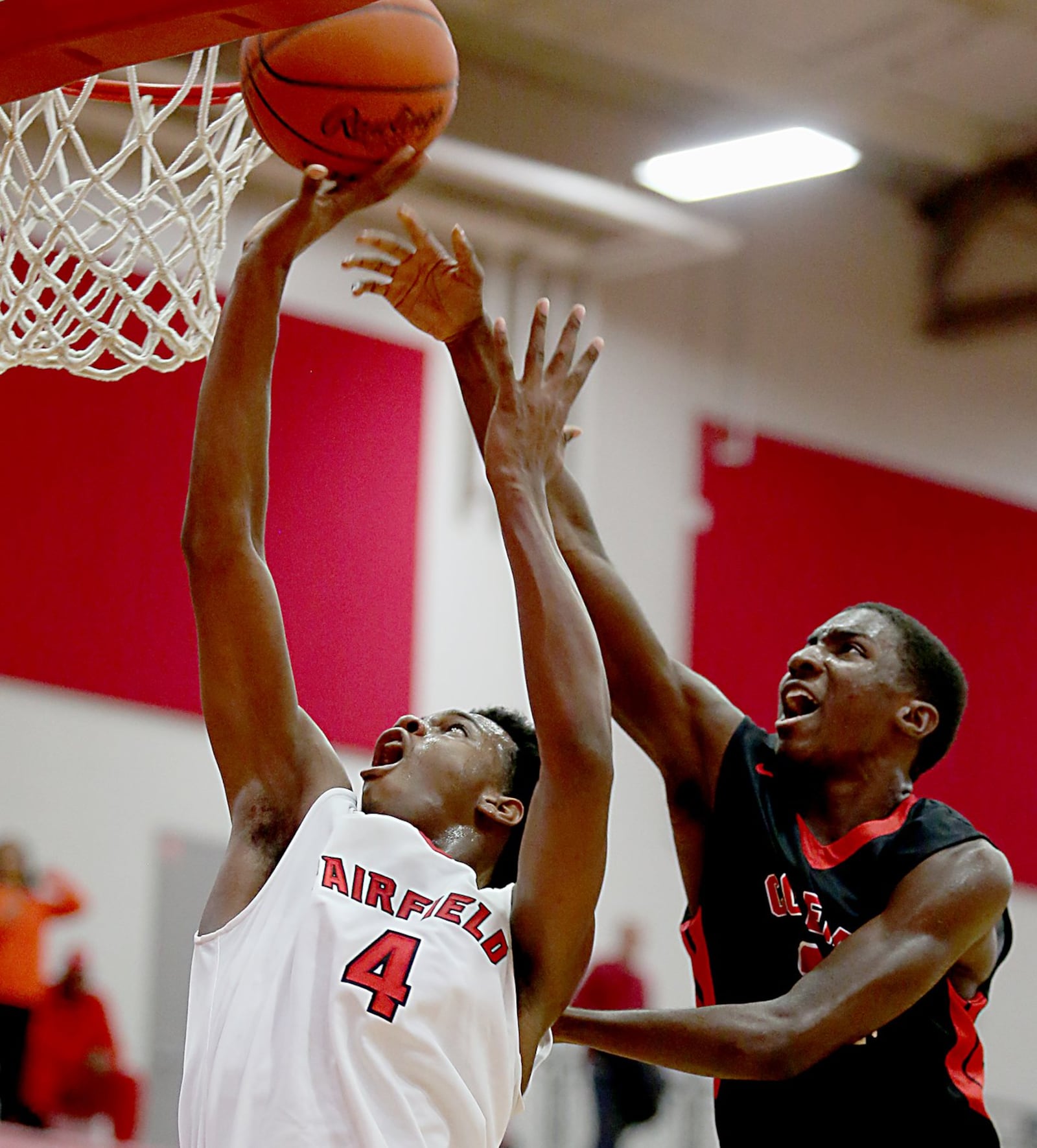 Fairfield forward Devonte Ross shoots under pressure from Colerain’s Cass Carter during Tuesday night’s game at Fairfield Arena. CONTRIBUTED PHOTO BY E.L. HUBBARD