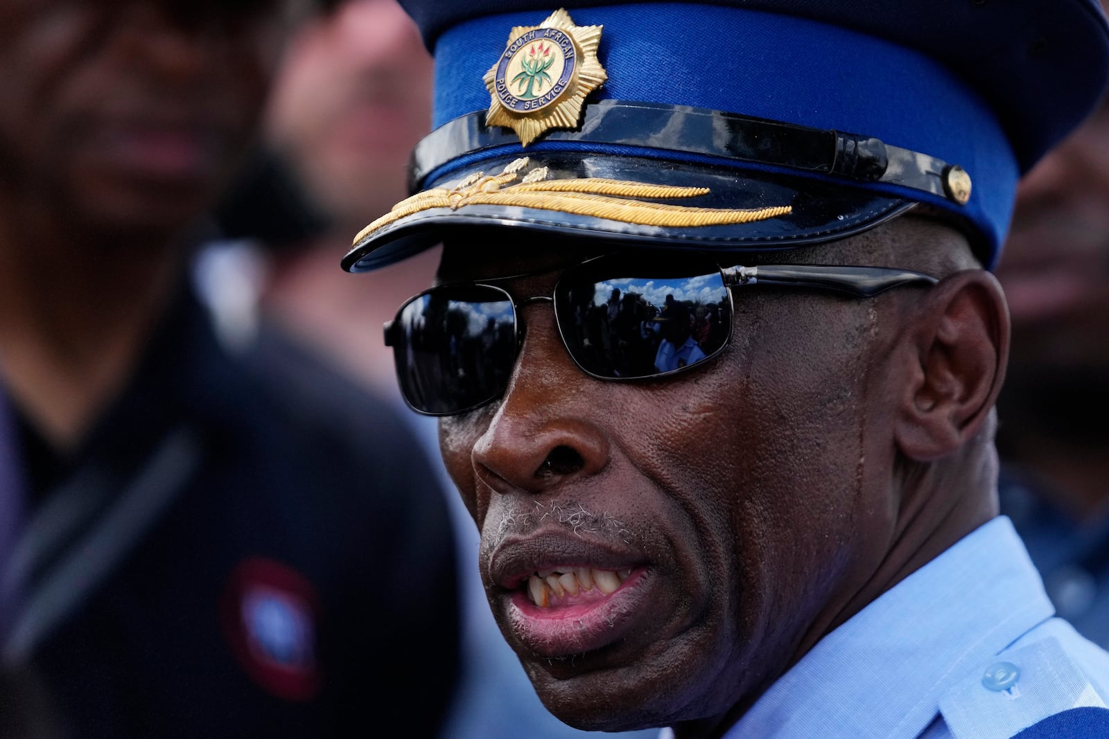 The Acting Provincial Commissioner of North West, Major General Patrick Asaneng, speaks to journalists outside an abandoned gold mine, where miners were rescued from below ground, in Stilfontein, South Africa, Thursday, Jan. 16, 2025. (AP Photo/Themba Hadebe)