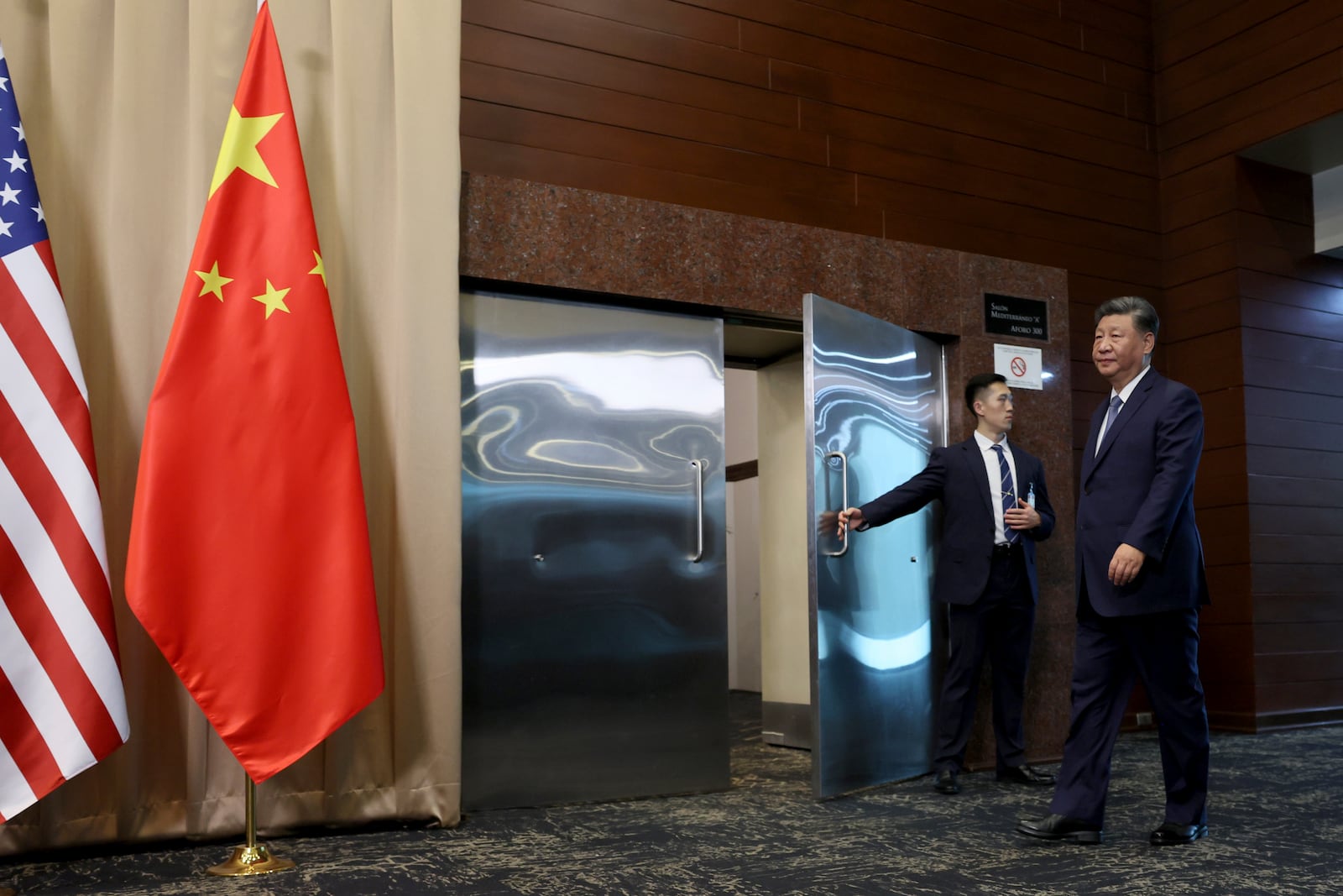 Chinese President Xi Jinping walks to meet President Joe Biden before a bilateral meeting, Saturday, Nov. 16, 2024, in Lima, Peru. (Leah Millis/Pool Photo via AP)