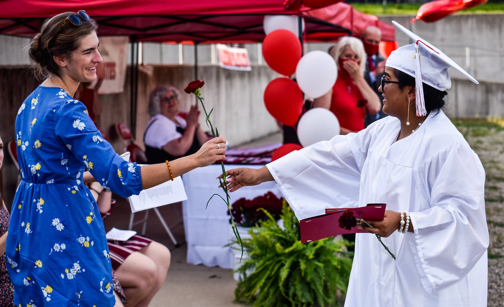 Madison High School drive-thru graduation ceremony at Land of Illusion