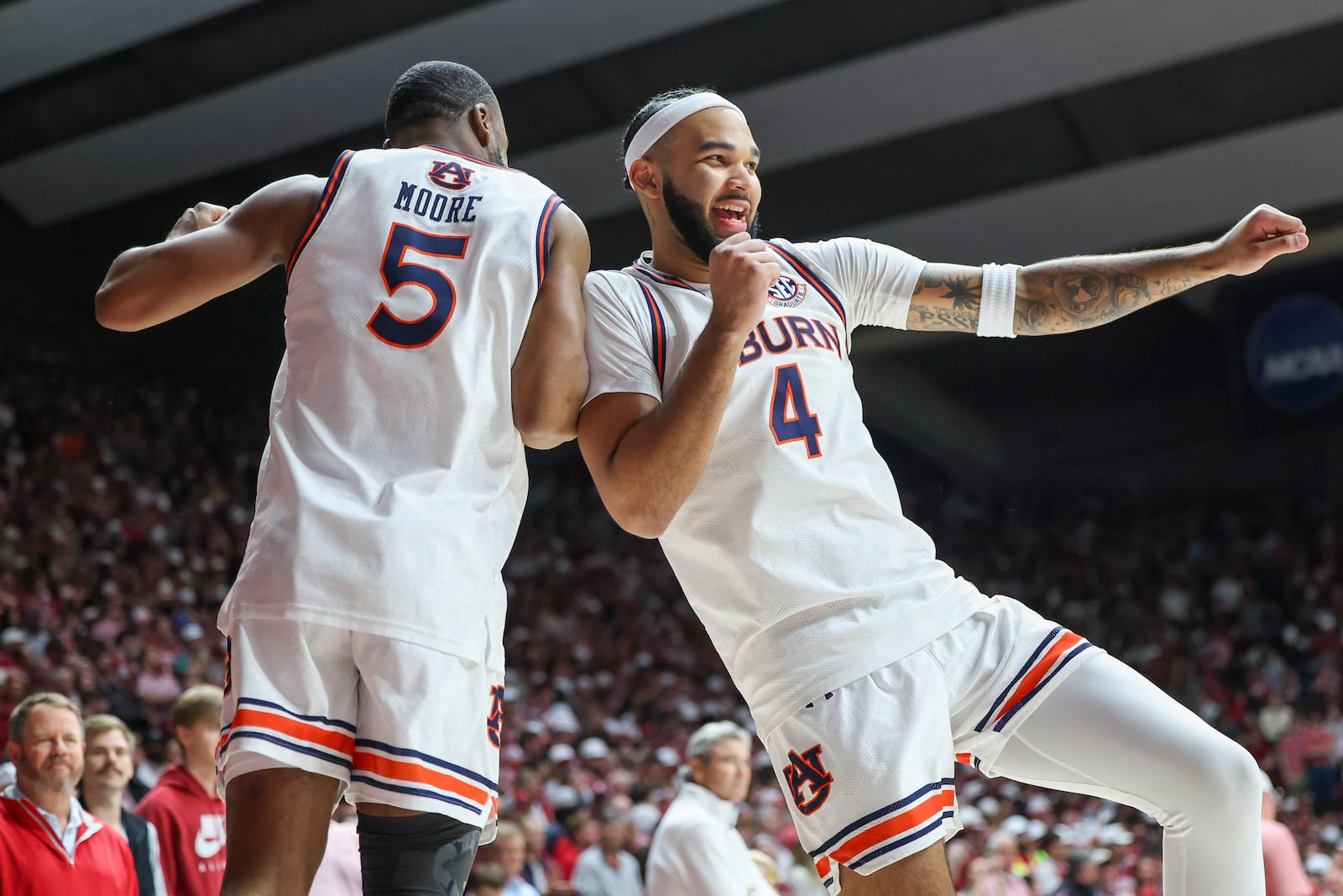 Auburn's Chris Moore (5) and Auburn's Johni Broome (4) rev up for the game before tip of the first half of an NCAA college basketball game against Alabama, Saturday, Feb. 15, 2025, in Tuscaloosa, Ala. (AP Photo/Vasha Hunt)