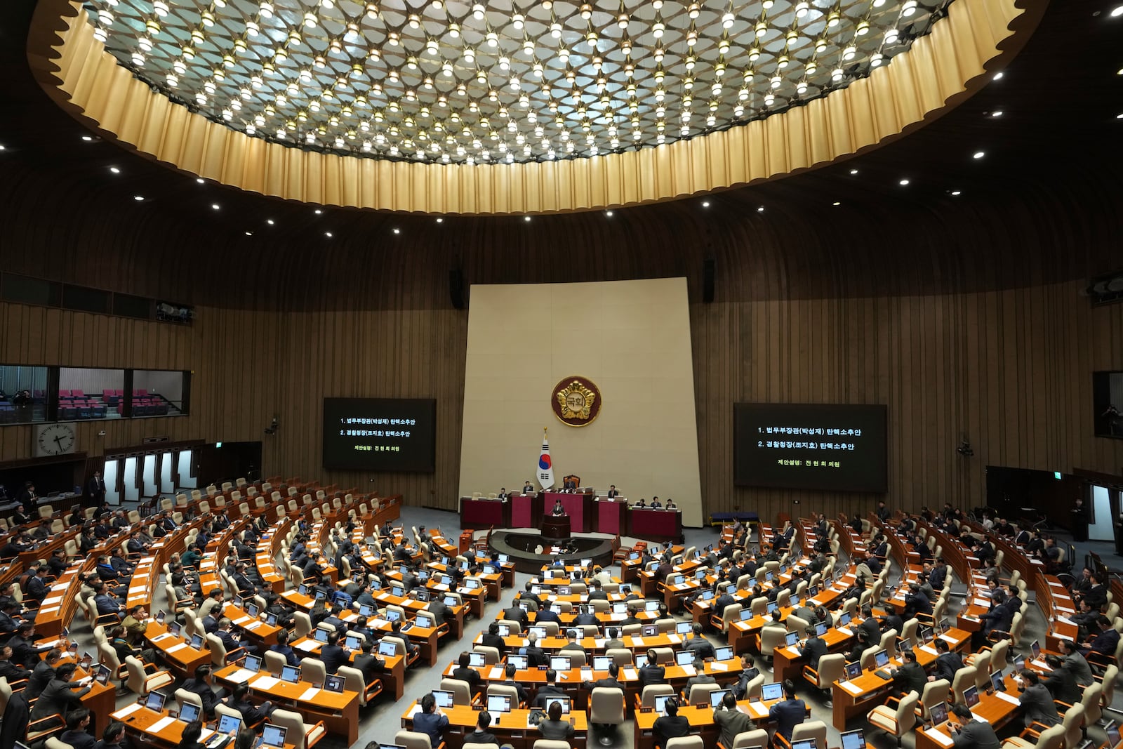 Lawmakers attend a plenary session held relating to the martial law declaration, at the National Assembly in Seoul, South Korea, Thursday, Dec. 12, 2024. (AP Photo/Lee Jin-man)