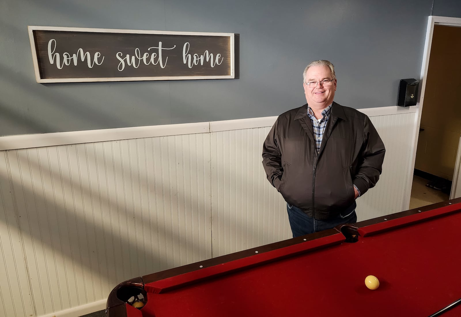 Rev. John Rice stands in One Way Farm's new transitional living center on Crawford Street in Middletown for kids who are aging out of its youth program. The new center will be able to accommodate 10 young adults in their own individual suites. NICK GRAHAM/STAFF