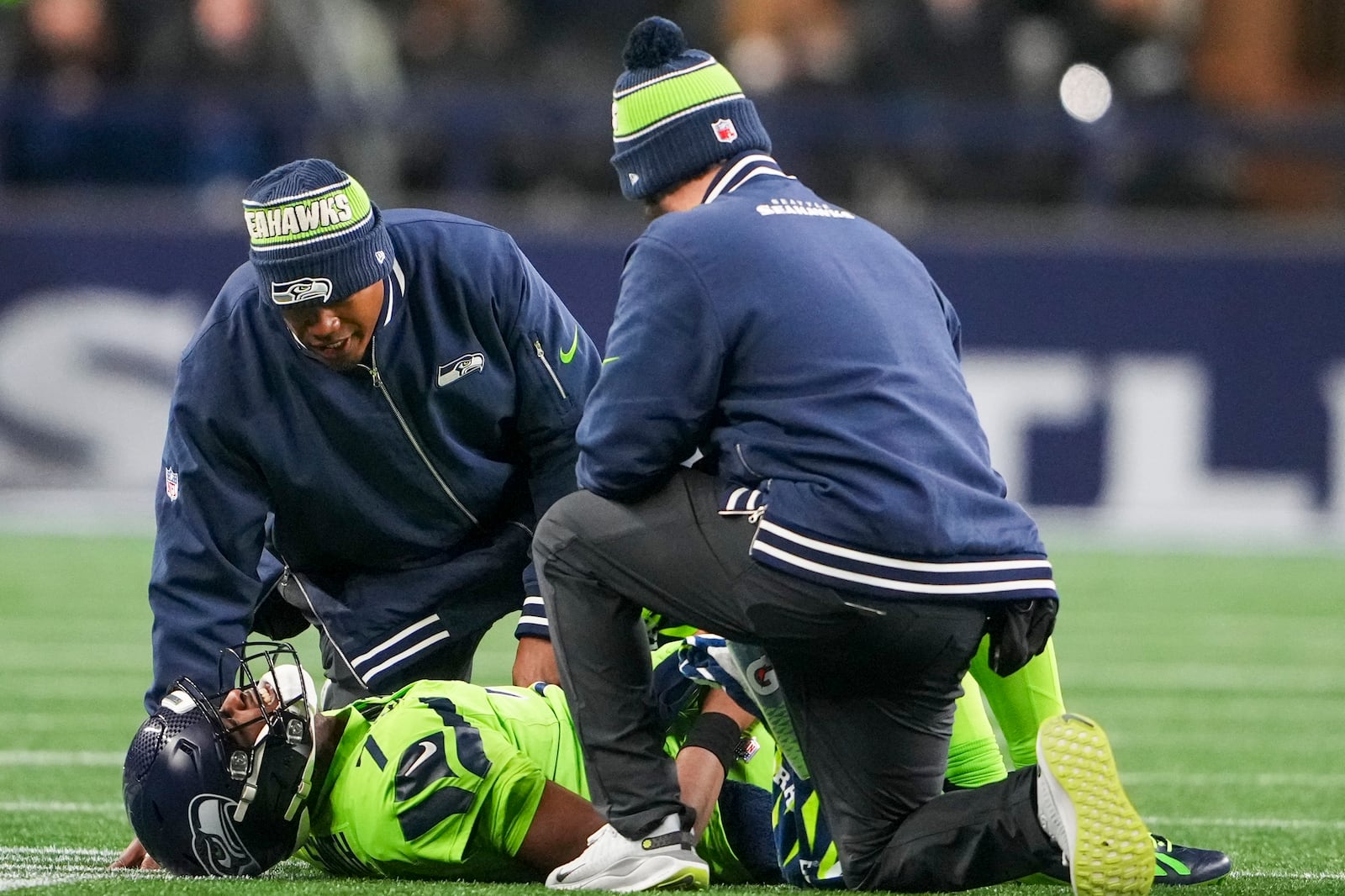 Seattle Seahawks' Geno Smith is hurt during the second half of an NFL football game against the Green Bay Packers Sunday, Dec. 15, 2024, in Seattle. (AP Photo/Lindsey Wasson)