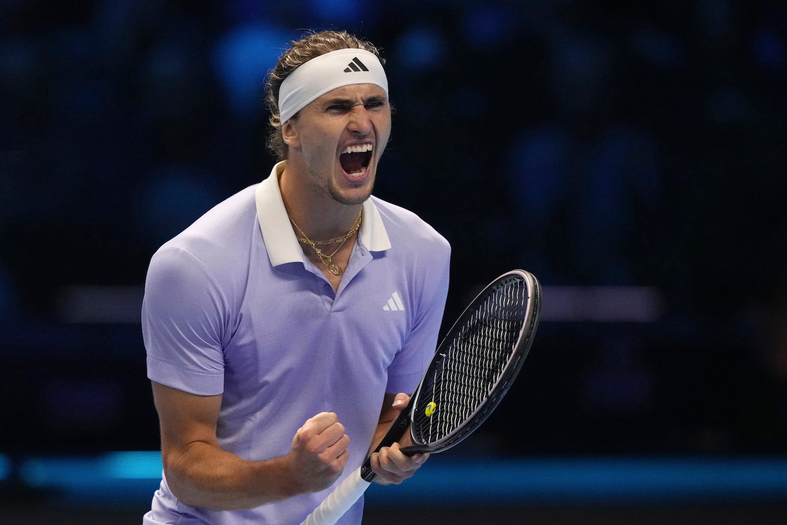 Germany's Alexander Zverev celebrates after winning the set point during the singles tennis match of the ATP World Tour Finals against Spain's Carlos Alcaraz, at the Inalpi Arena, in Turin, Italy, Friday, Nov. 15, 2024. (AP Photo/Antonio Calanni)