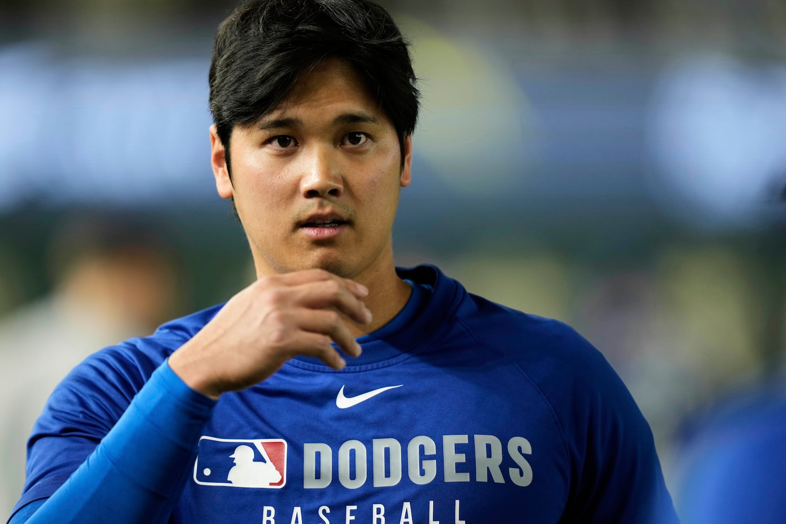 Los Angeles Dodgers' Shohei Ohtani stands on the field during warmups before a spring training baseball game against the Yomiuri Giants in Tokyo, Japan, Saturday, March 15, 2025. (AP Photo/Eugene Hoshiko)