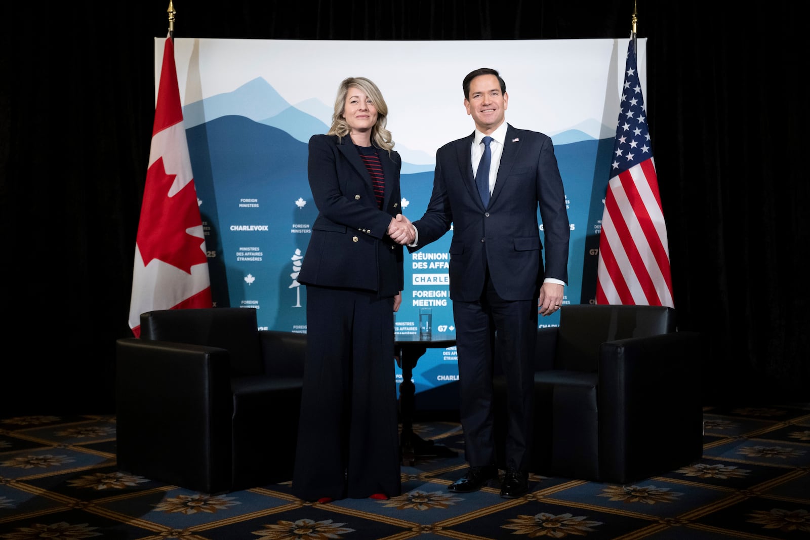 Canadian Foreign Minister Melanie Joly shakes hands with U.S. Secretary of State Marco Rubio during the G7 meeting of foreign ministers in Charlevoix, Quebec, Thursday, March 13, 2025. (Saul Loeb/Pool via AP)