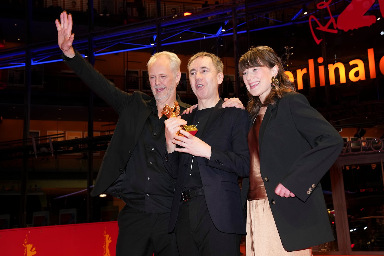 Yngve Saether, from left, Dag Johan Haugerud and Hege Hauff Hvattum, winners of the Golden Bear for best film for 'Dreams (Sex Love)', pose for photographers at the winners photo call during the International Film Festival, Berlinale, in Berlin, Saturday, Feb. 22, 2025. (Photo by Scott A Garfitt/Invision/AP).