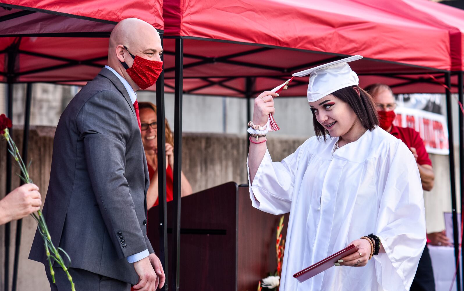 Madison High School drive-thru graduation ceremony at Land of Illusion