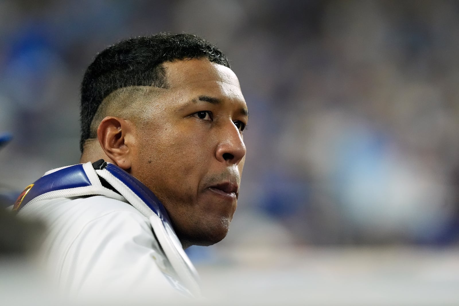 Kansas City Royals' Salvador Perez watches from the dugout during the fifth inning in Game 4 of an American League Division baseball playoff series against the New York Yankees Thursday, Oct. 10, 2024, in Kansas City, Mo. (AP Photo/Charlie Riedel)