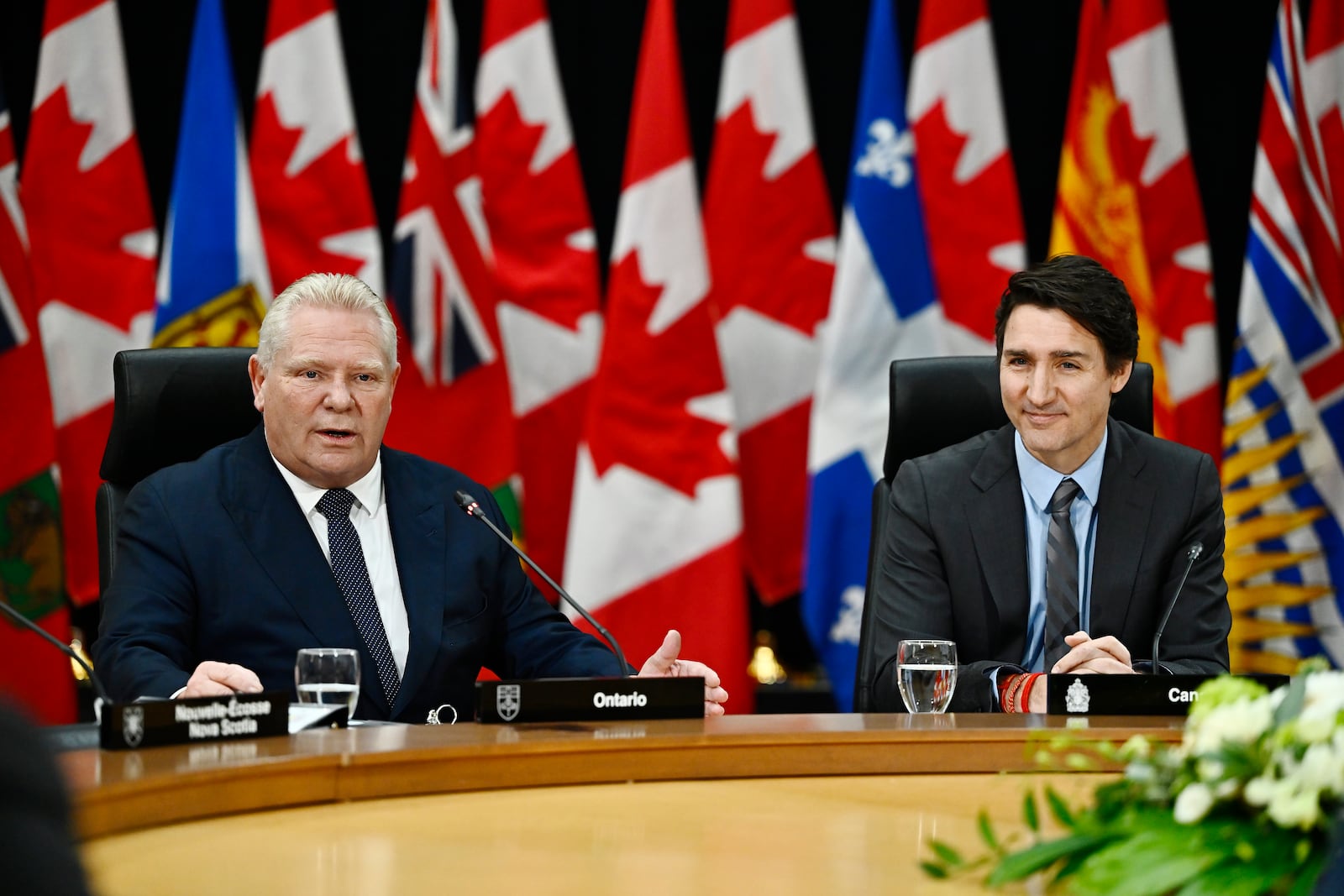 Ontario Premier Doug Ford, left, speaks, as Prime Minister Justin Trudeau looks on during a first ministers meeting in Ottawa on Wednesday, Jan. 15, 2025. (Justin Tang/The Canadian Press via AP)