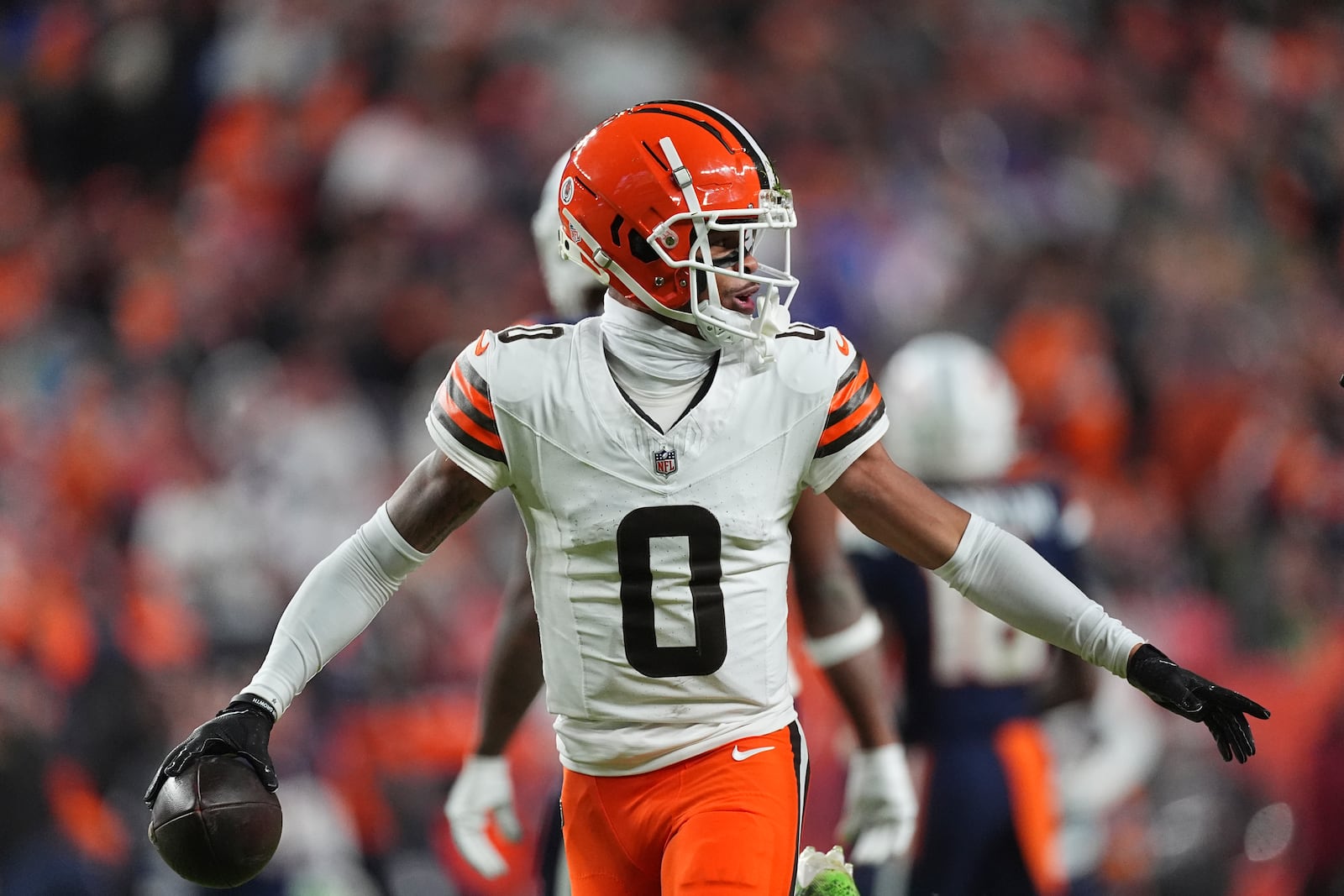 Cleveland Browns cornerback Greg Newsome II runs to the bench after intercepting a pass during the first half of an NFL football game against the Denver Broncos, Monday, Dec. 2, 2024, in Denver. (AP Photo/David Zalubowski)