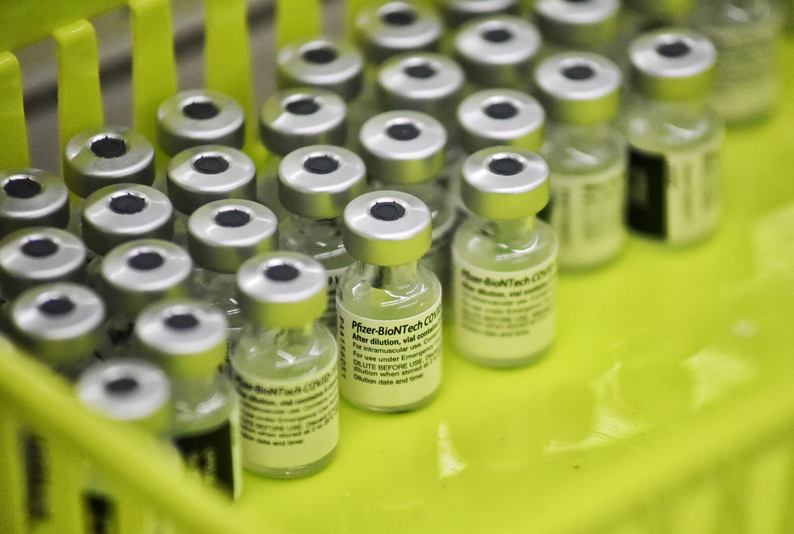 Viles of Covid-19 vaccines are prepared to be administered to school staff Wednesday, February 3, 2021 at Lakota West High School in West Chester Township. NICK GRAHAM / STAFF