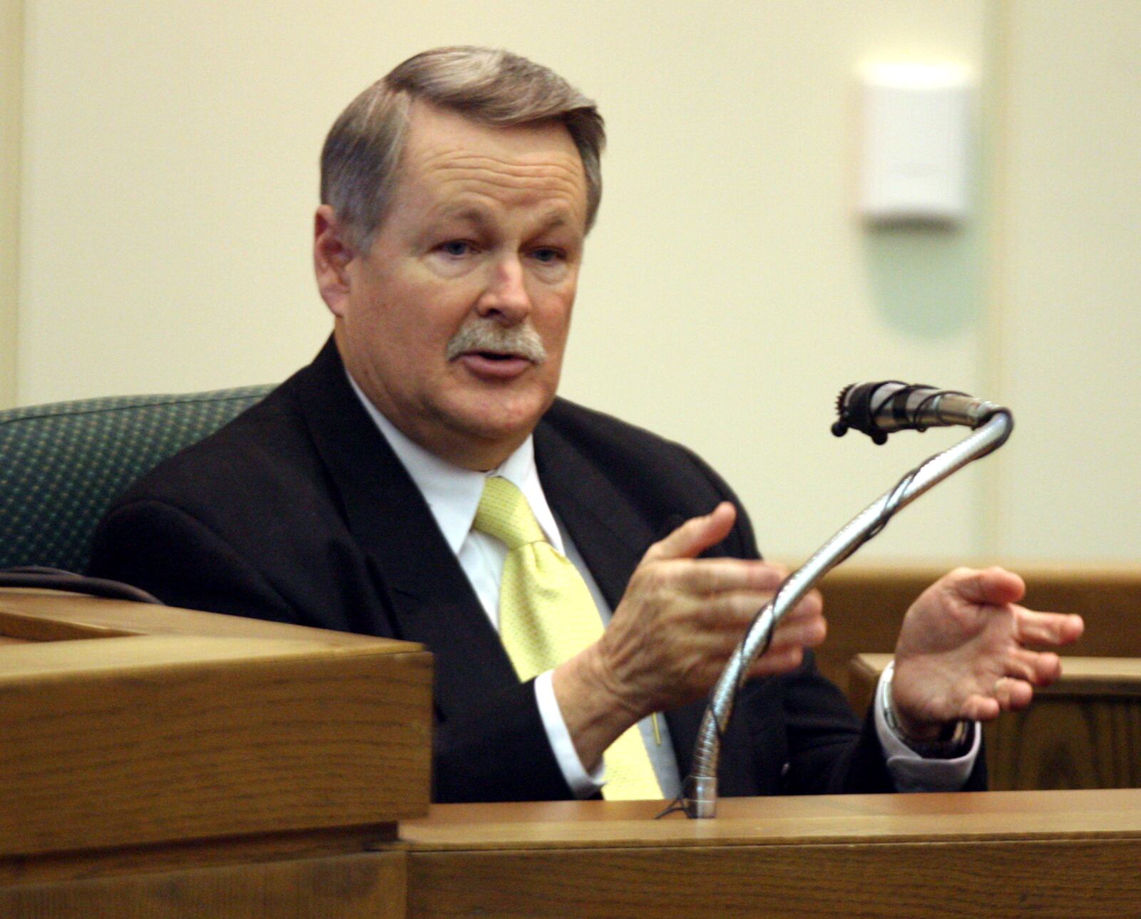 Doyle Burke, chief investigator for the Warren County Coroner's Office, testifies in Warren County Common Pleas Court Thursday, Jan. 27, 2011, about his experience at the Ryan Widmer home in August 2008. Staff photo by Greg Lynch