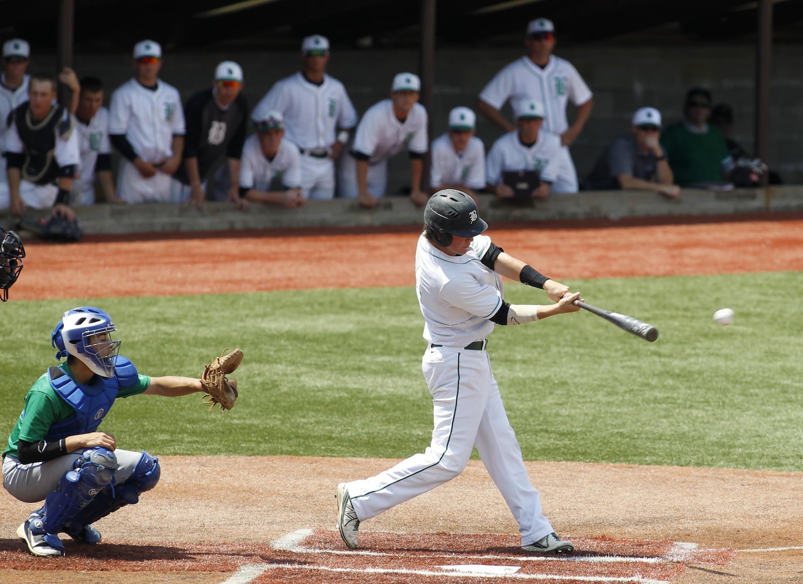 Badin’s Alex Holderbach takes a cut during a Division III regional semifinal against Chaminade Julienne on May 29, 2014, at the Athletes in Action complex in Xenia. CJ won 2-1. COX MEDIA FILE PHOTO