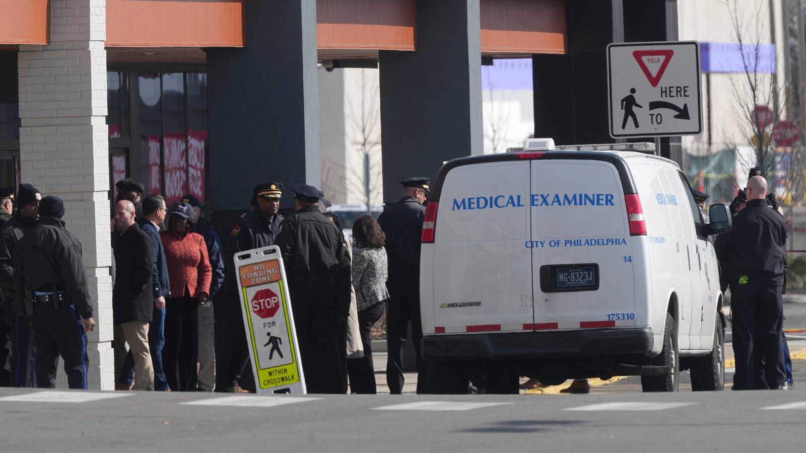 Pennsylvania Gov. Josh Shapiro, Philadelphia Mayor Cherelle Parker and other officials view the aftermath of a fatal small plane crashed in Philadelphia, Monday, Feb. 3, 2025. (AP Photo/Matt Rourke)