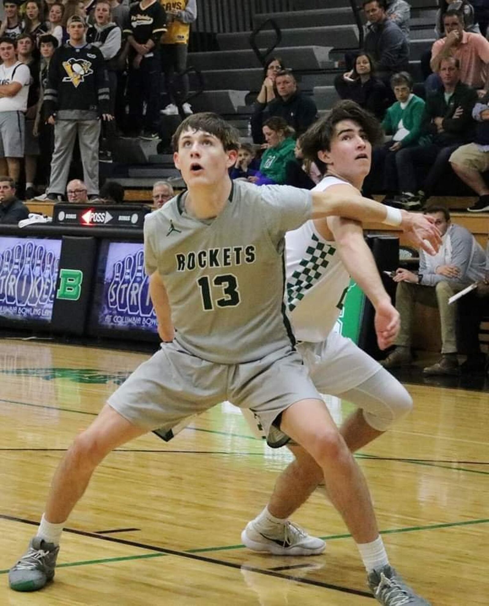 Evan Brunot (13) of McNicholas boxes out Badin’s Seth Hargis during Friday night’s game at Mulcahey Gym in Hamilton. McNick won 47-45. CONTRIBUTED PHOTO BY TERRI ADAMS